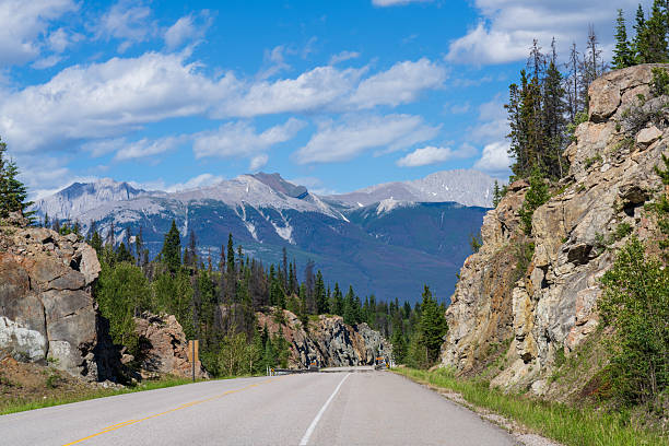 Yellowhead Highway in Jasper National Park, Alberta, Canada. Roche Bonhomme mountain summit in the background.