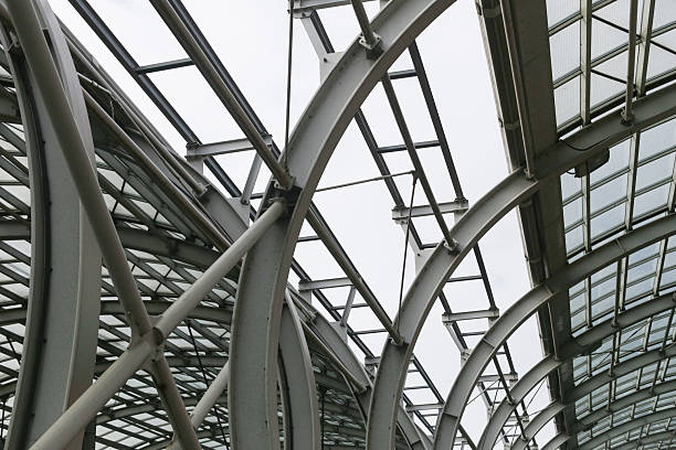 istock Modern steel structure design. Glass roof with curved beams. Futuristic architecture elements. Industrial building ceiling. 2208148233