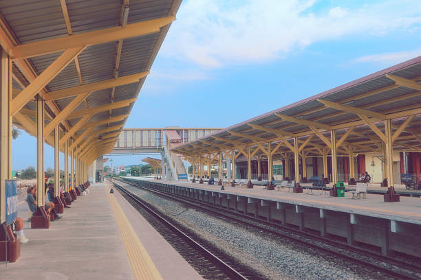 Train station Double track railway overpass platform travelling by train in Thailand with bright blue sky
