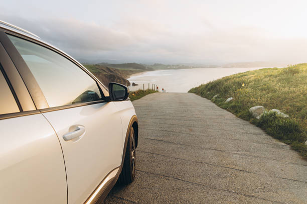 istock Car on a road by the sea 2208154574