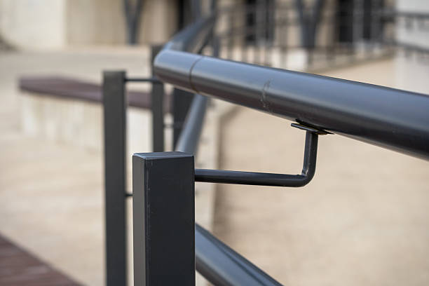 istock .black metal railing with curved tube and rectangular supports. 2208154877