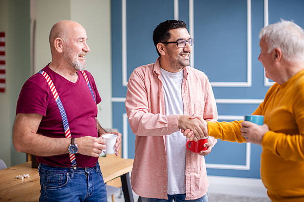 istock Veterans enjoying camaraderie and sharing stories while relaxing indoors in a friendly setting 2208155796