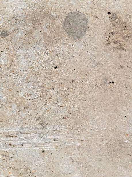 istock Closeup texture of a weathered textured concrete surface reveals a rustic gray expanse marked by scratches 2208155887