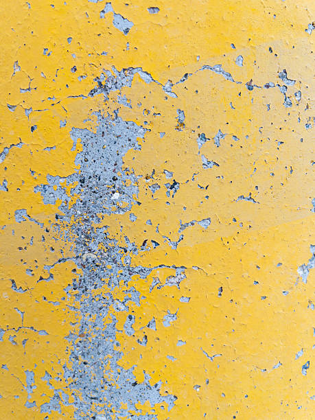 istock Texture of yellow painted weathered concrete wall 2208156498
