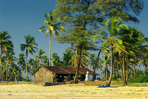 Landscape of tropical beach with ocean, blue sky and  bungalow during summer sunny day