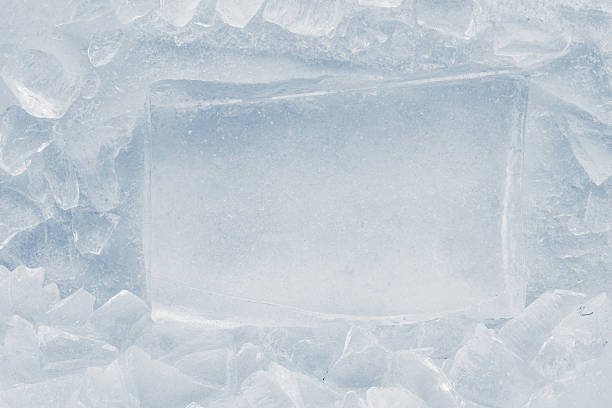 istock Ice block in the light blue tones surrounded with crushed ice on white background. 2208159137