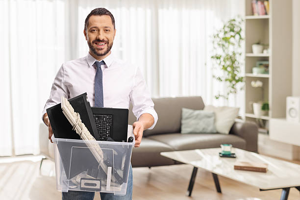 Businessman holding a plastic box with old electronic devices Businessman holding a plastic box with old electronic devices for recycling laptop in a trash bin stock pictures, royalty-free photos & images