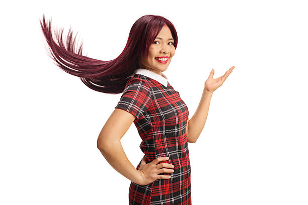 Young asian woman with long flying hair isolated on white background