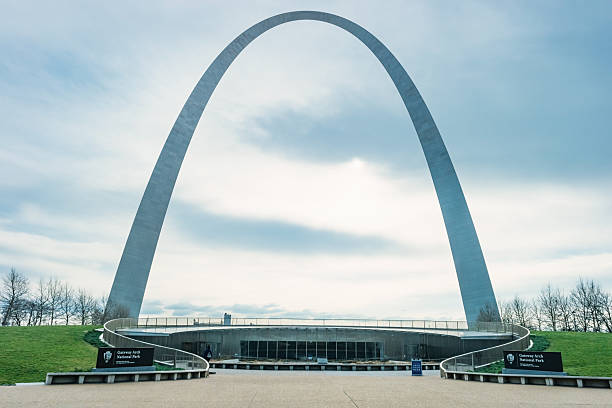 Gateway Arch National Park and visitor center in downtown St Louis Missouri USA on a cloudy day.