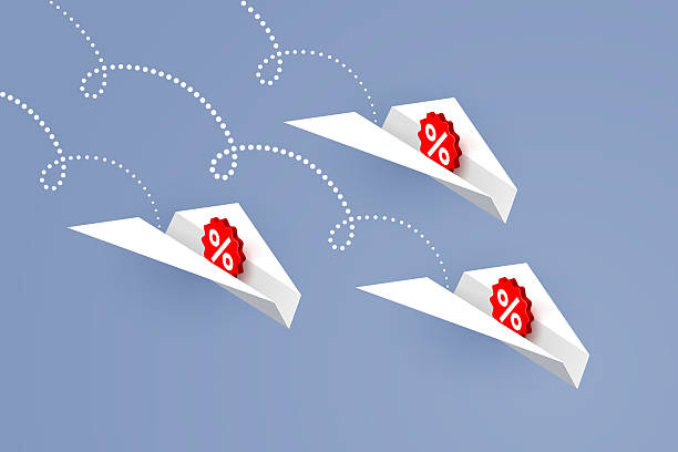 istock White paper airplanes with percent signs are flying downward 2208164617