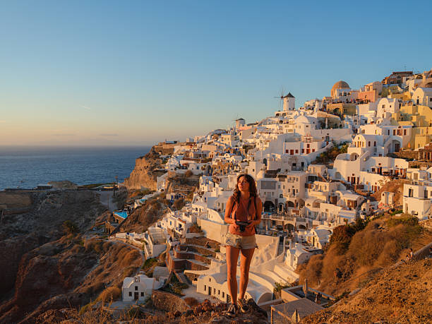 istock Woman looking with awe in Oia, Santorini 2208164739