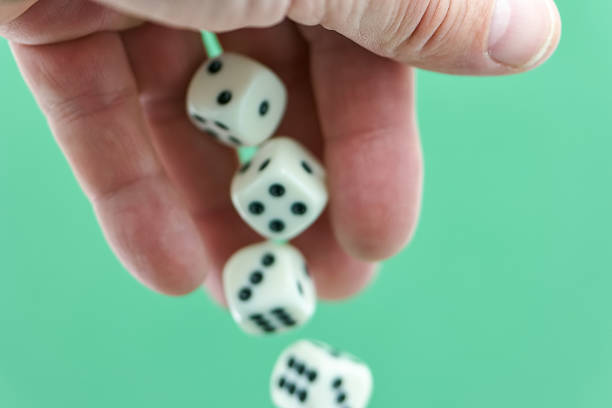 Dice and poker cards on white background