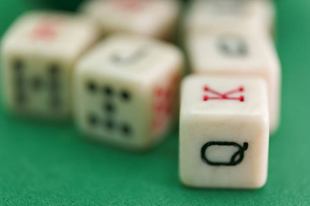 Dice with a lucky winning combination of two sixes on a green table in a poker club. A pleasant win depends on luck and fortune.