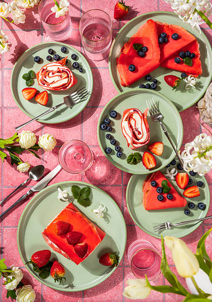 Delicious reddish pancakes and strawberry cake on plates for dessert