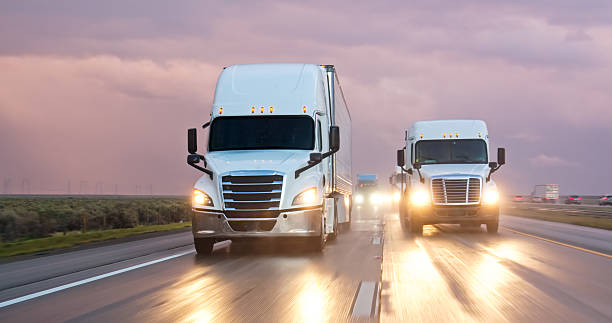 istock Tanker Trailer Passing Semi-Truck on Interstate 5 on Stormy Evening 2208170599