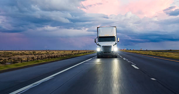 Cargo Semi-Truck Driving Past a Flat Rural Landscape on Interstate 5
