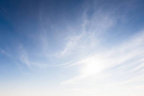 istock A serene image showcasing a clear blue sky adorned with soft, wispy clouds 2208172758