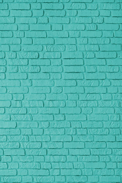 istock Turquoise color painted brick wall texture, brickwork, masonry of stone blocks vertical background 2208173927