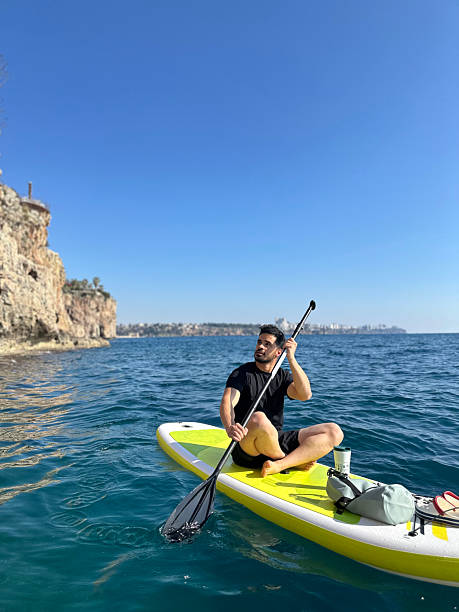 istock Young man paddle boarding in antalya, turkey, enjoying scenic coastline 2208177868