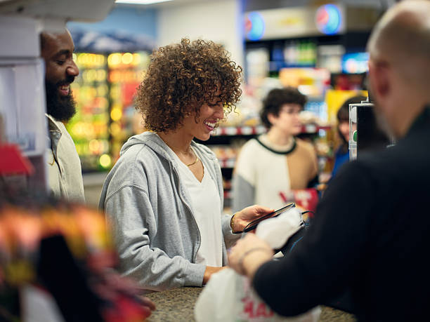 istock Young Couple Shopping in a Convenience Store 2208179285