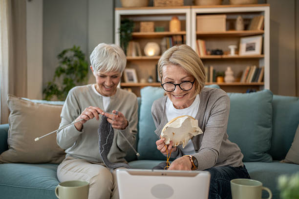 istock Elderly women having fun crafting together at home 2208181314