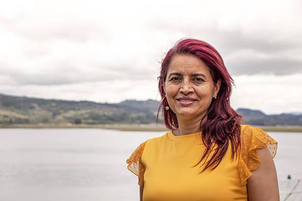 istock Cheerful old - senior woman posing by a lake 2208181381