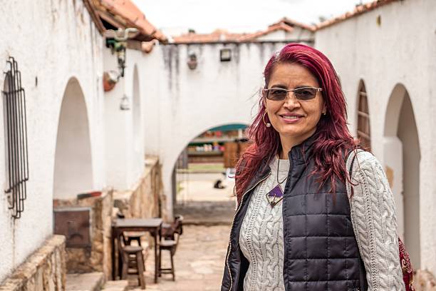 istock Cheerful old - senior woman posing in front of a historic brick structure 2208181387