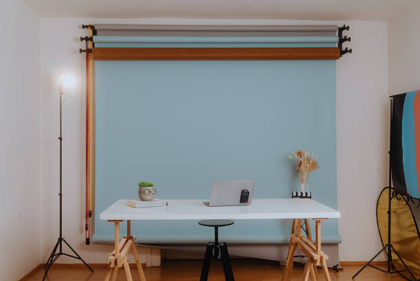 istock Modern photo studio with desk, laptop, and backdrop 2208182788