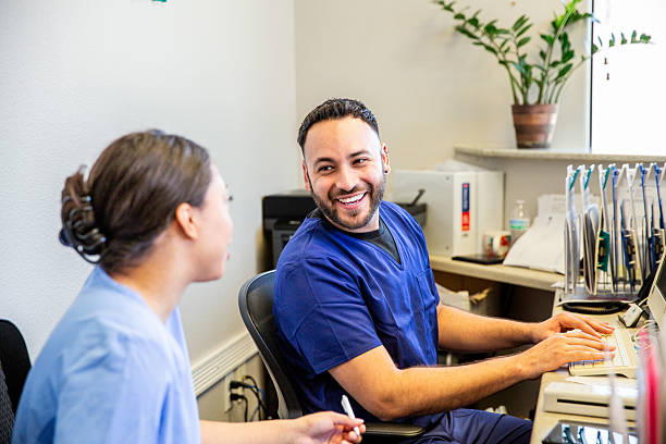 Nurses working at the front reception area of a medical office