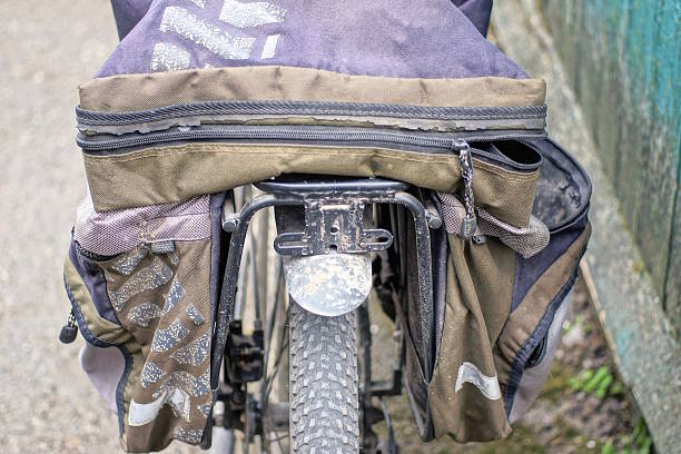 istock one empty gray black backpack bag lies on a  bicycle trunk 2208189841