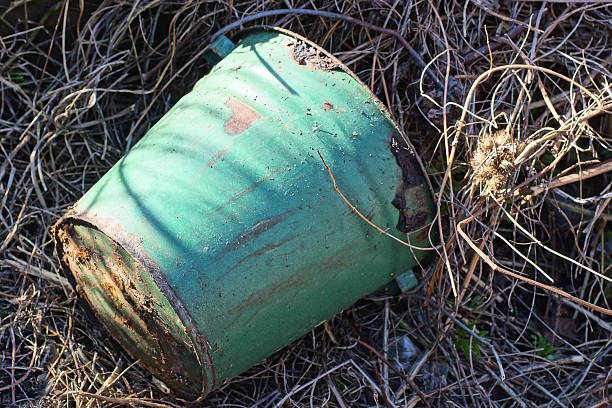 istock one old big green dirty metal bucket 2208190164