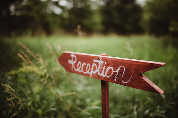 istock Wedding reception wood arrow sign 2208190175