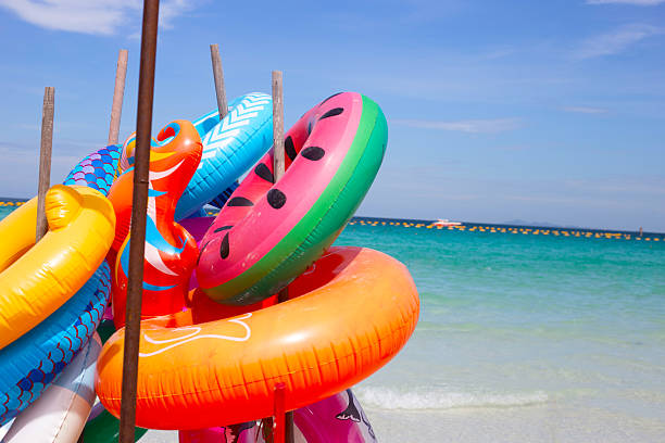 istock Inflatable rings on the beach. Summer concept 2208196368