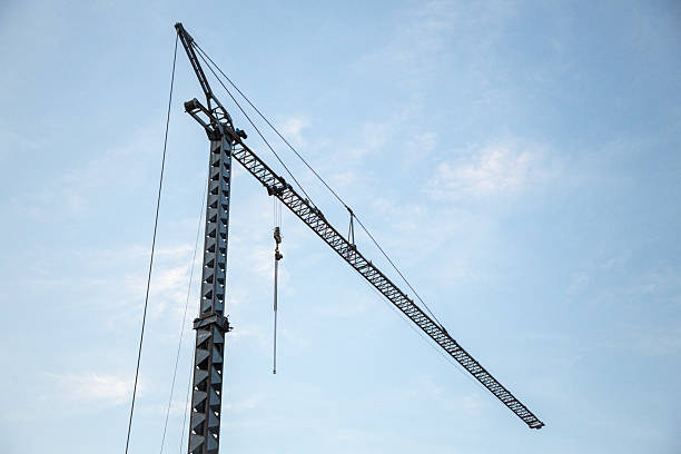istock Towering Construction Crane Against Sky – Industrial Strength 2208198641