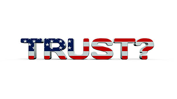 istock the word TRUST with the American flag and a question mark - white background 2208198840
