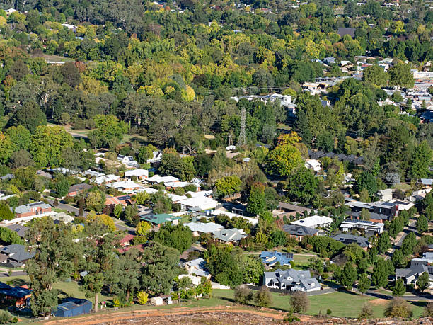 istock High angle view of houses surrounded by trees 2208200858