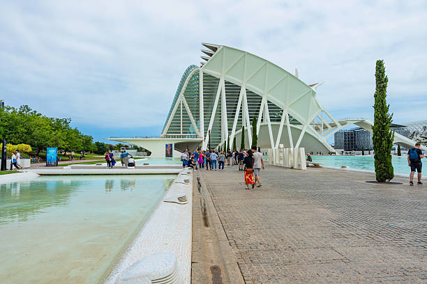 Valencia, Spain - September 5, 2019: People walk round the Agora building at the City of Arts and Sciences. Designed by Santiago Calatrava, the multi function event space was opened in 2009.