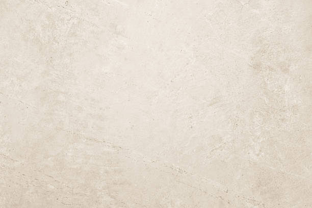Colour old concrete wall texture background. Close up retro plain cream color cement wall background texture. Design paper vintage parchment element.