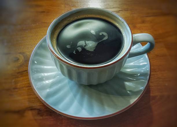 istock A cup of coffee on the wooden table 2208205873