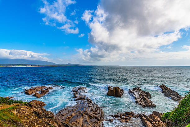 Scenic views over the sea from Sunrise Point next to the Breakwall and Marina in Bermagui, NSW, Australia.