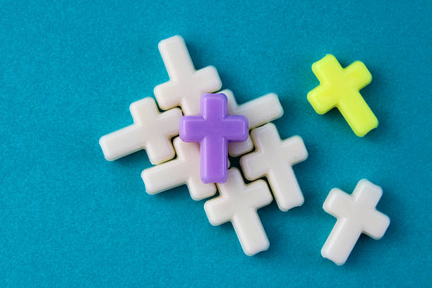 istock Two crosses that are distinguished by their color from the rest 2208210215