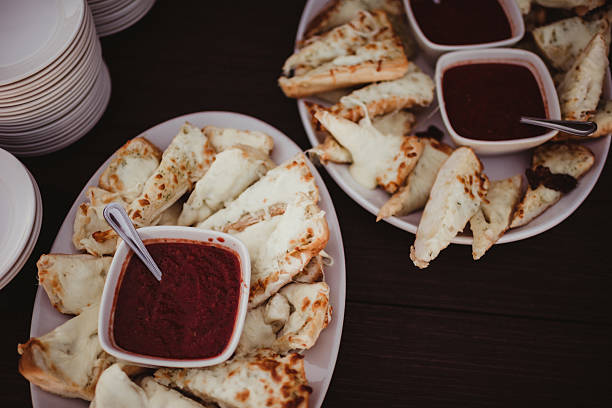 Warm cheese bread with marinara sauce appetizer buffet at party