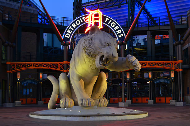 Entrance to Comerica Park, Detroit Detroit, MI, USA May 18 A large tiger sculpture is illuminated at night outside of Comerica Park, home to the Detroit Tigers baseball team comerica park photos stock pictures, royalty-free photos & images