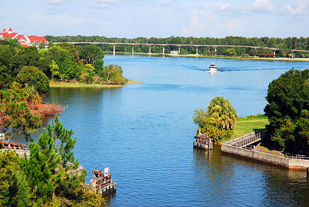 A small boat plies the waters of the wetlands in Florida