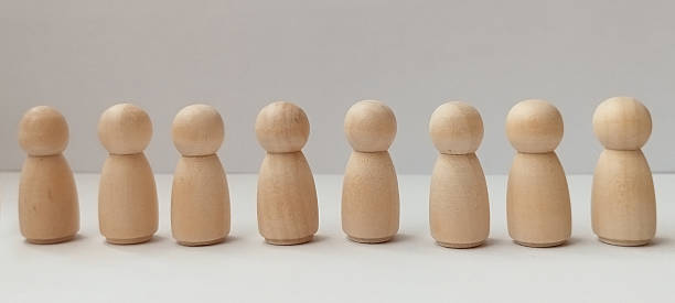 istock Wooden figurines arrangement studio setting minimalist art neutral background close-up perspective art concept 2208226944