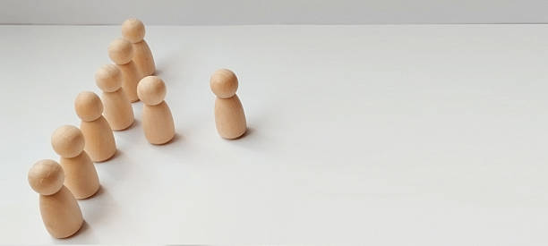 istock Team building activities office setting wooden figures minimalist environment straight-on view collaboration concept 2208226950