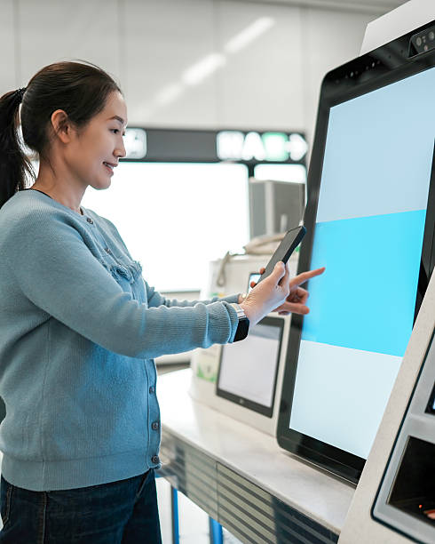 istock Engaging User Interface at a Modern Airport Self-Service Kiosk 2208229766