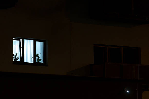 istock A residence with many windows is beautifully lit at night 2208230750