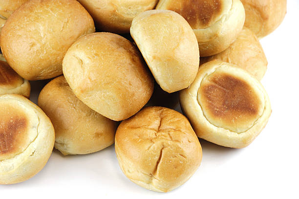 istock close up on fresh baked dinner roll isolated on white background 2208230767