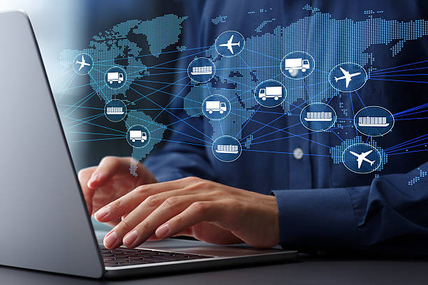 istock Global supply chain and logistics management. Intermodal transportation and distribution networks. Businessman using laptop computer to track freight. 2208231381